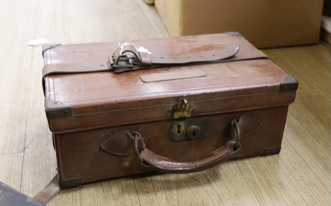 A 19th century leather cartridge magazine and a similar gun case (2)